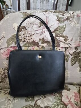 Vintage Black Leather Satchel with Gold Emblem